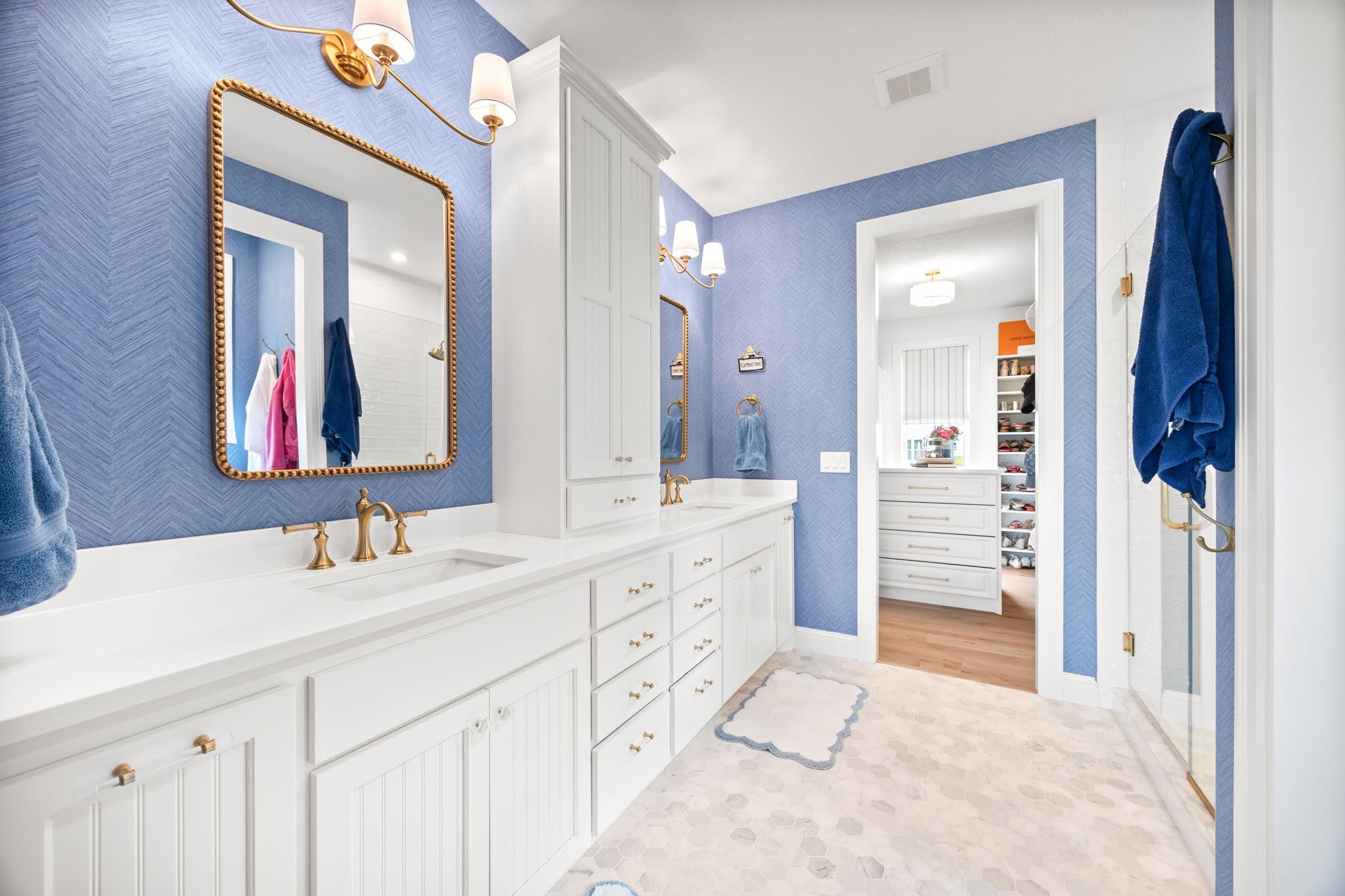 Powder room with navy floral wallpaper
