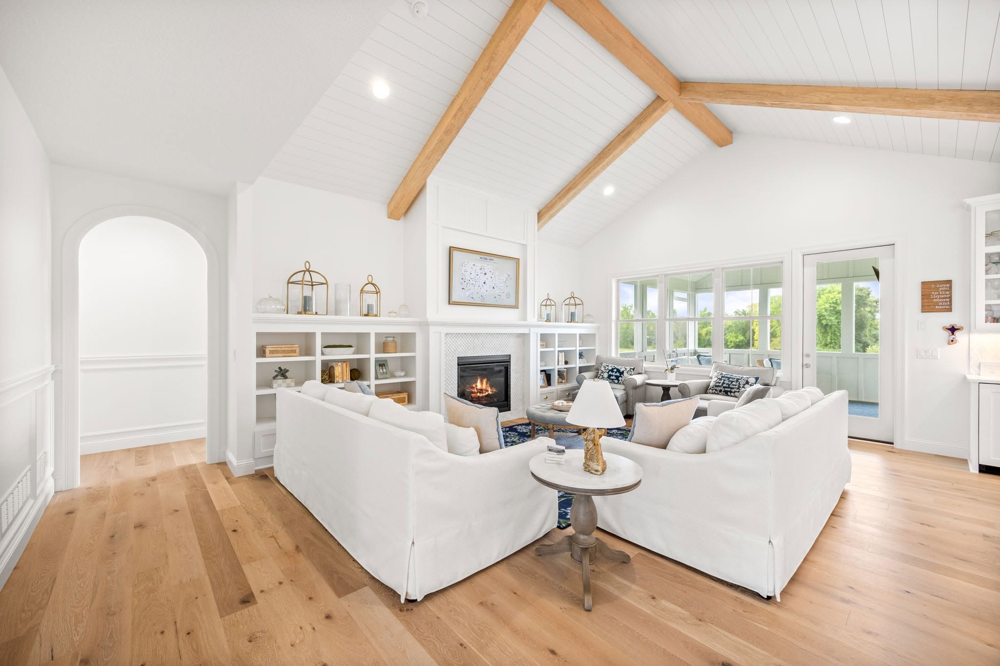 Great room with vaulted ceiling and beams