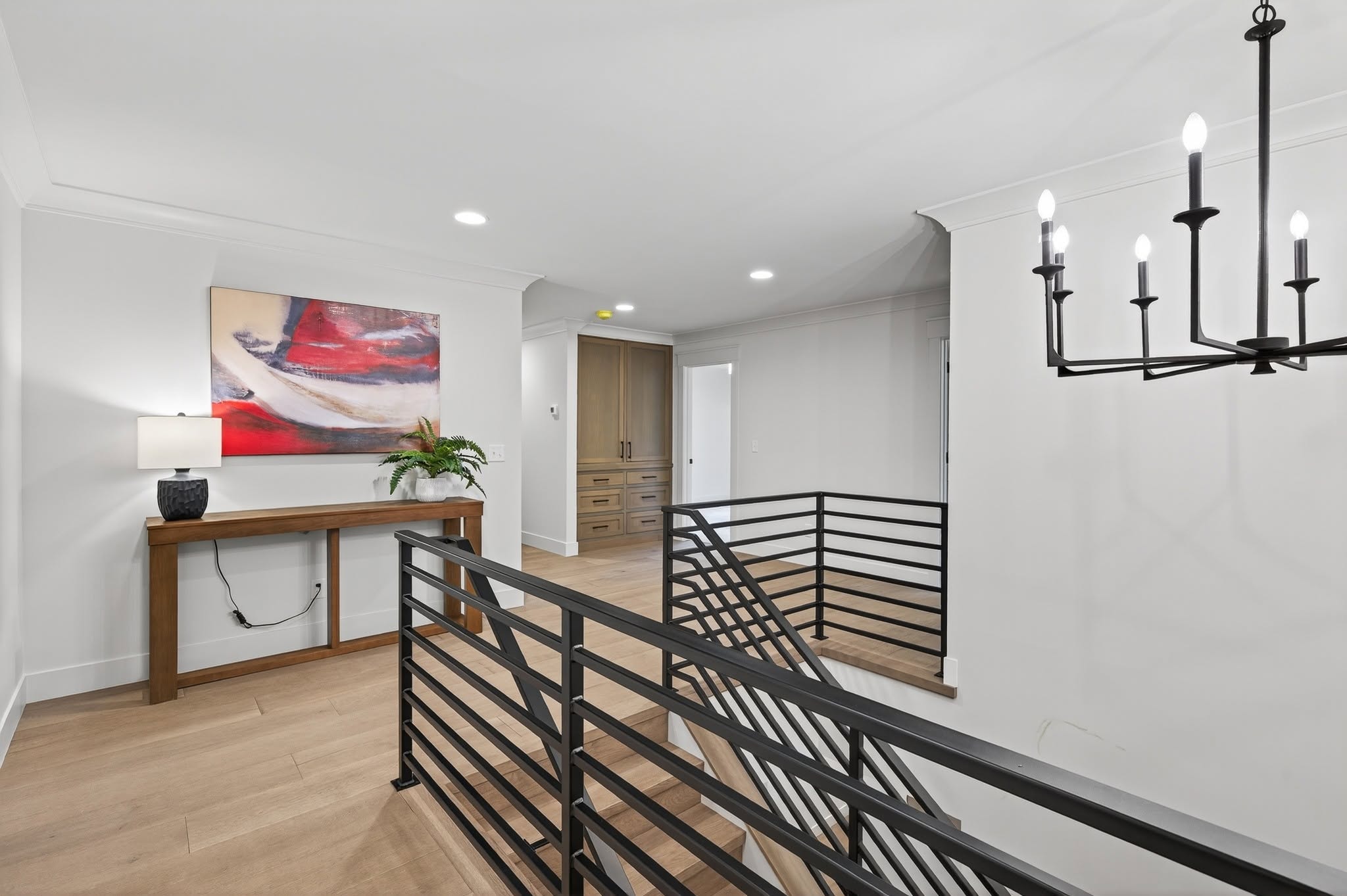 Upper hallway landing with black railing